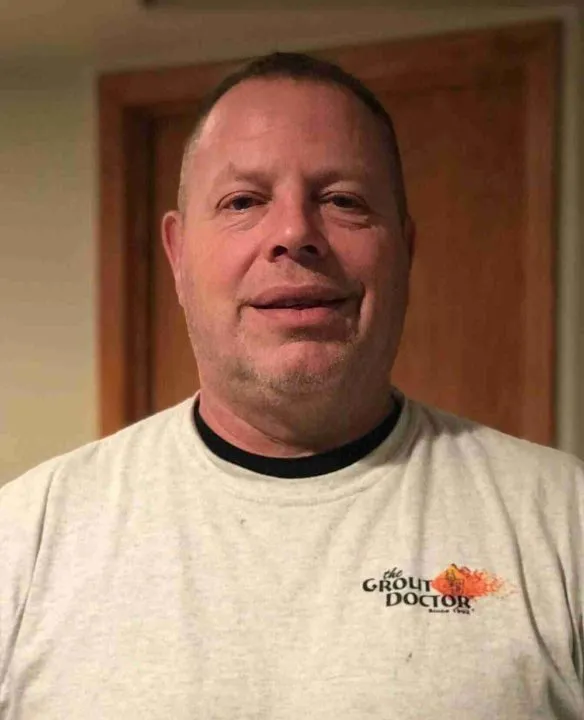 cure_all_white_background_1024x1024@2x Man smiling, wearing a shirt with logo.