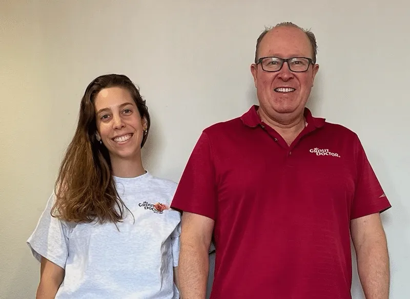 cure_all_white_background_1024x1024@2x Two smiling individuals in Grout Doctor attire.