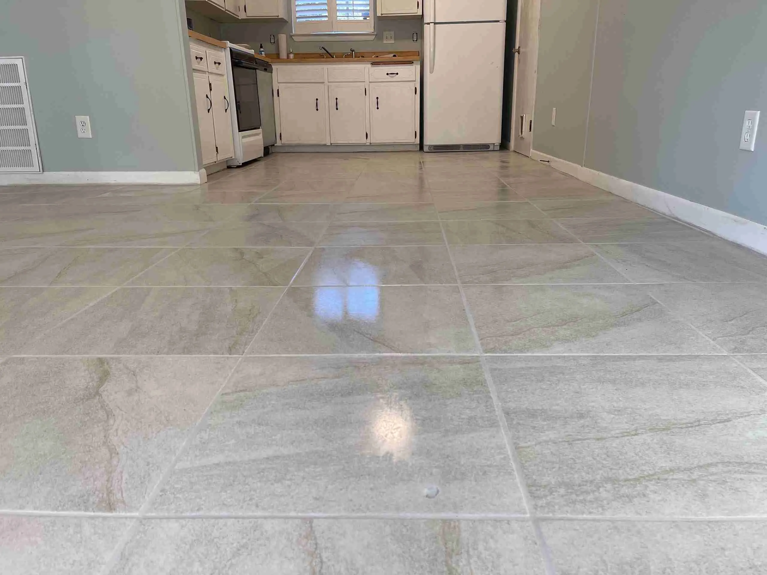Modern kitchen with elegant gray tile flooring.