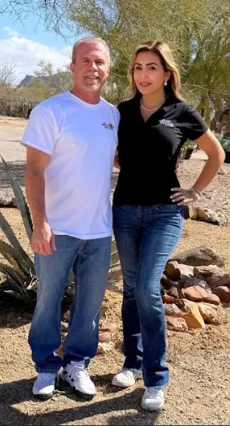 cure_all_white_background_1024x1024@2x Two people standing outdoors in casual attire.