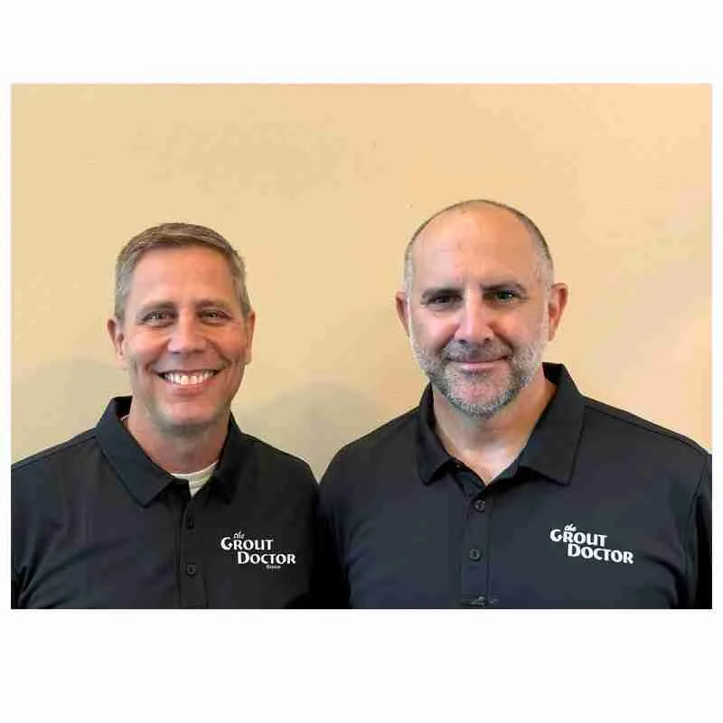 cure_all_white_background_1024x1024@2x Two men smiling in branded polo shirts